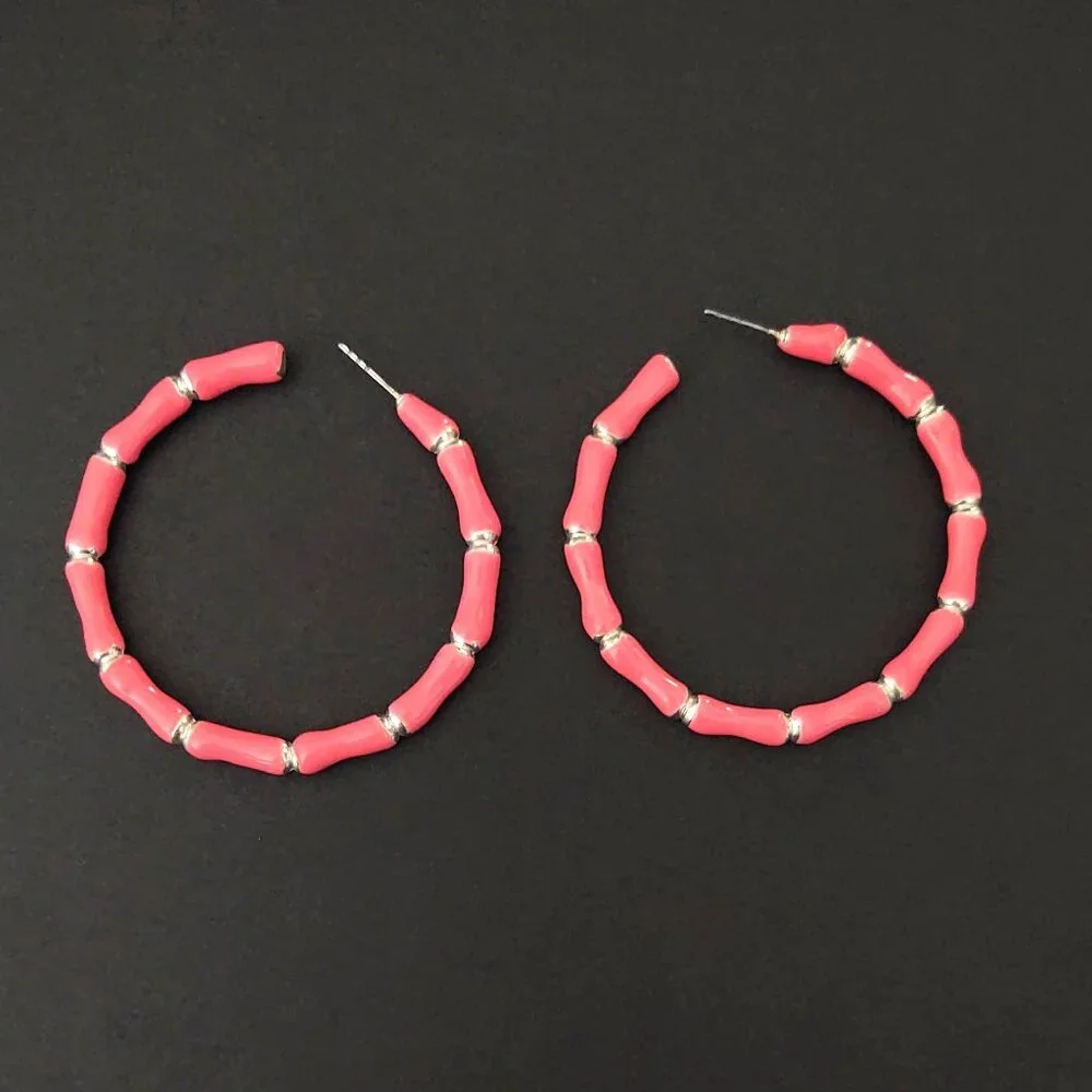 Bright glossy salmon pink enamel and silver tone hoops
